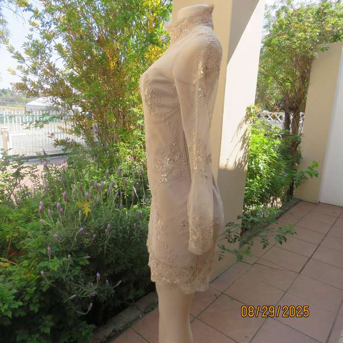 Gold colour richly embroidered mini dress in satin and sheer fabric. Size 30-32
