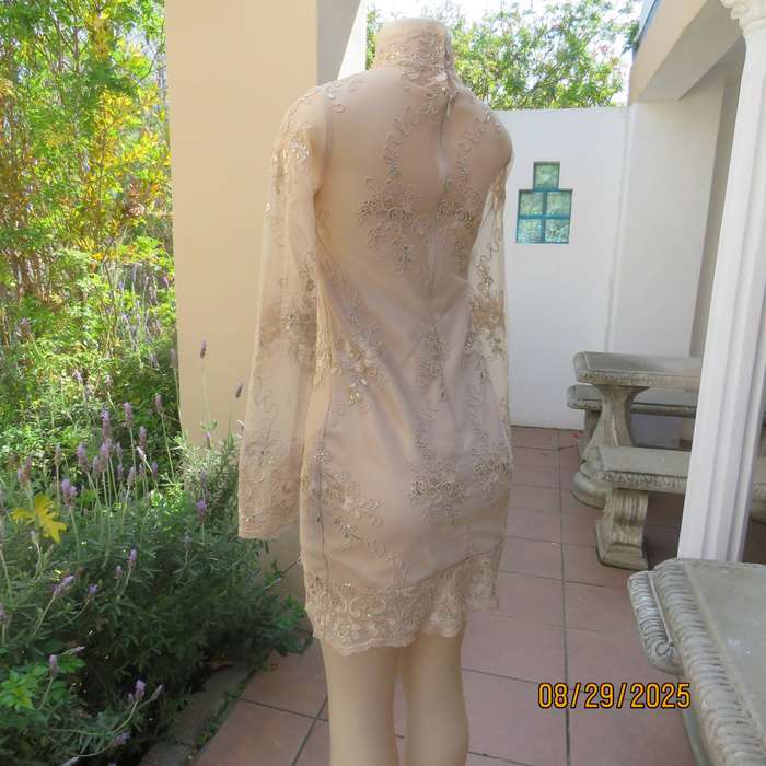 Gold colour richly embroidered mini dress in satin and sheer fabric. Size 30-32