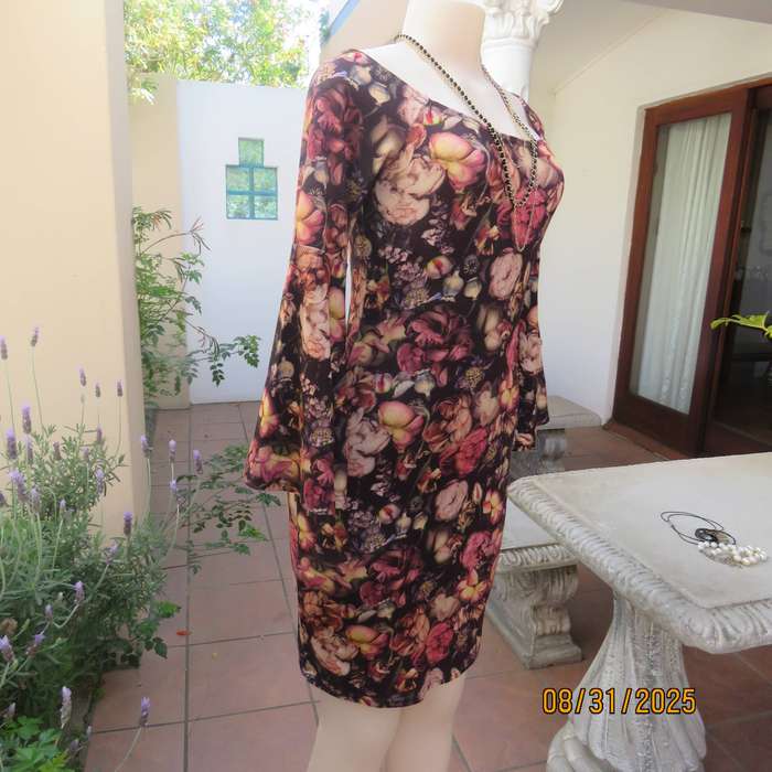 Burgundy bodycon knee length dress with floral print. Long sleeves-bell cuffs. Size 34