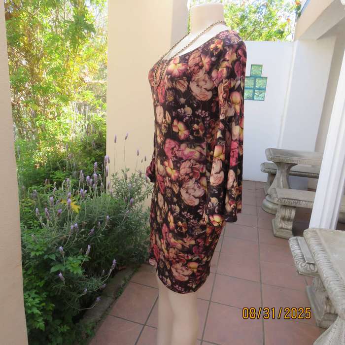 Burgundy bodycon knee length dress with floral print. Long sleeves-bell cuffs. Size 34