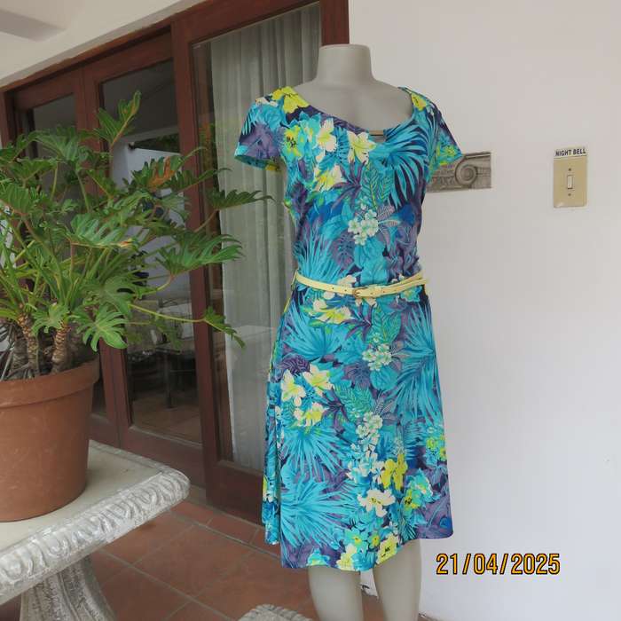 Turquoise-blue patterned stretch polyester slip over size 40 dress with yellow flowers.
