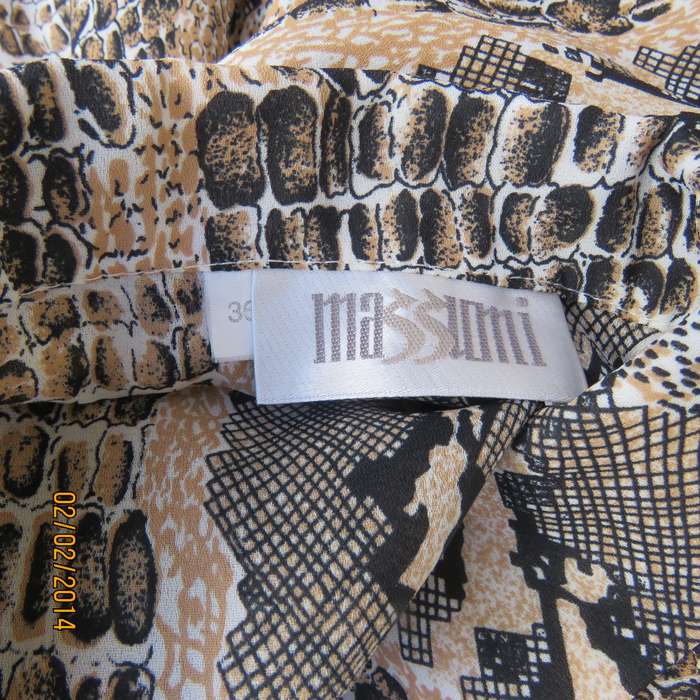 Elegant animal print polyester top size 36. Beige-peach and black. Bracelet length sleeves. As new