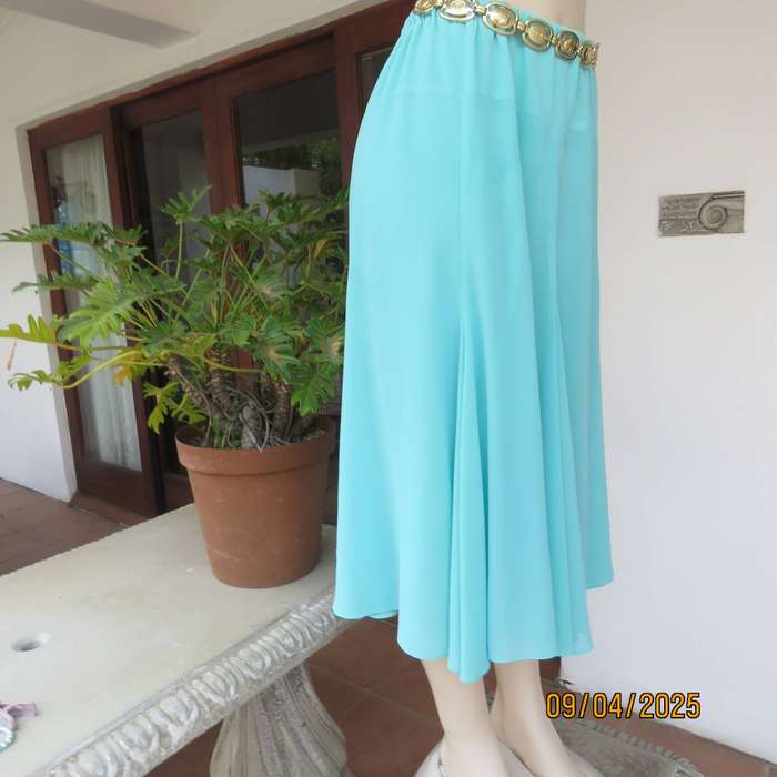 Aqua colour kick-out paneled skirt with wide yoked elasticated waist. Lined. Size 36