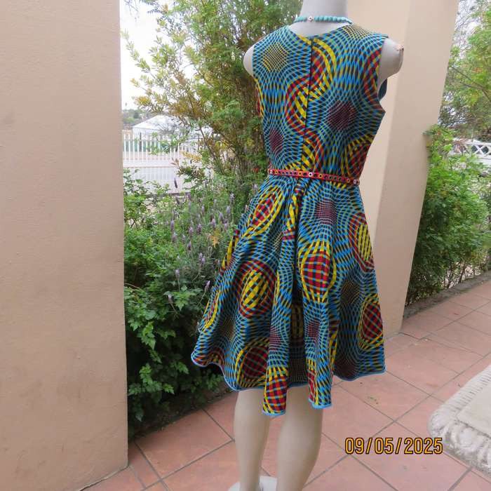 Colourful geometric printed flare sleeveless dress. Zip at back. Size 34