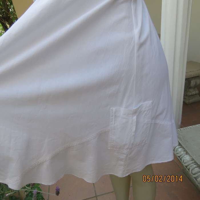As new white slightly creased 100% cotton strappy dress. Size 36.Elasticated waist.Half flare skirt.