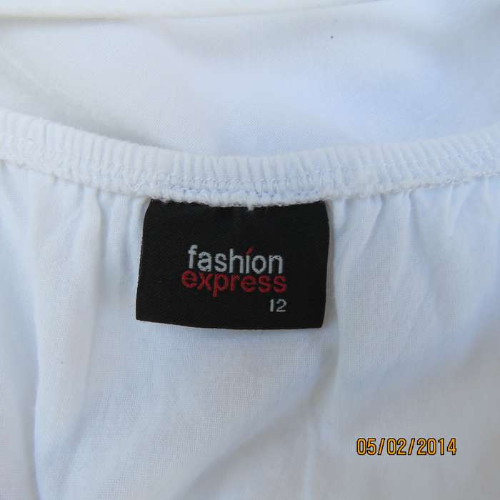 As new white slightly creased 100% cotton strappy dress. Size 36.Elasticated waist.Half flare skirt.