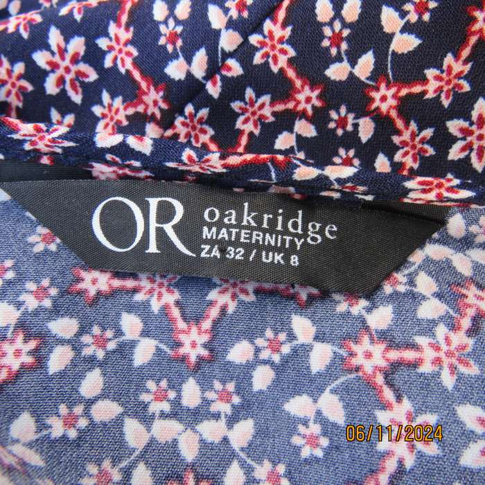 Cool maternity empire style dress in poly-rayon blend.Navy with white-pink flowers.Size 32-34.As new