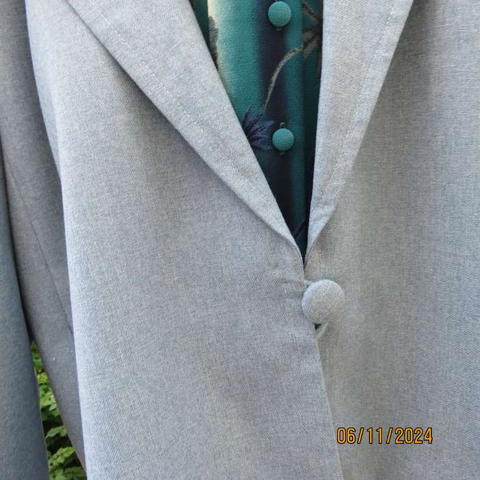 Boutique made light blue polyester-wool blend long sleeve jacket..One button.Size 50