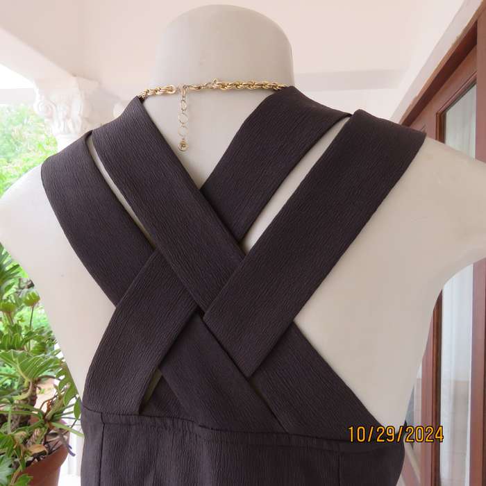 Beautiful black sleek button down ankle length dress by CHARLOTTE size 36. Criss cross strap back.