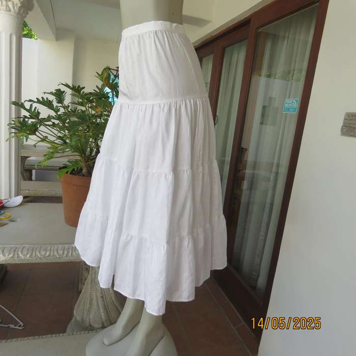 Boutique made white creased silky polyester tiered skirt. Underlayer with netting.Size 34