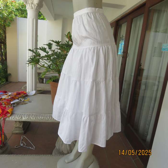 Boutique made white creased silky polyester tiered skirt. Underlayer with netting.Size 34