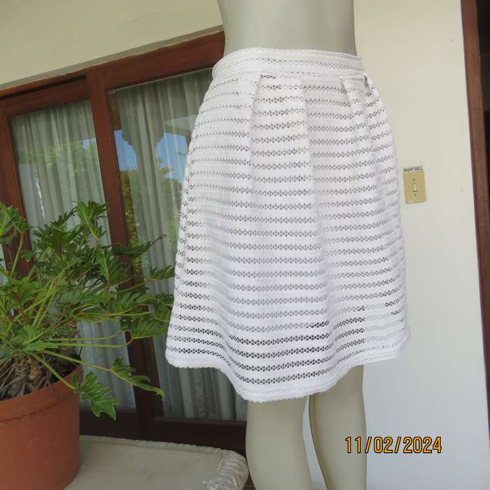 White 2 layer polyester lace knee length skirt size 36. With few knife pleats.