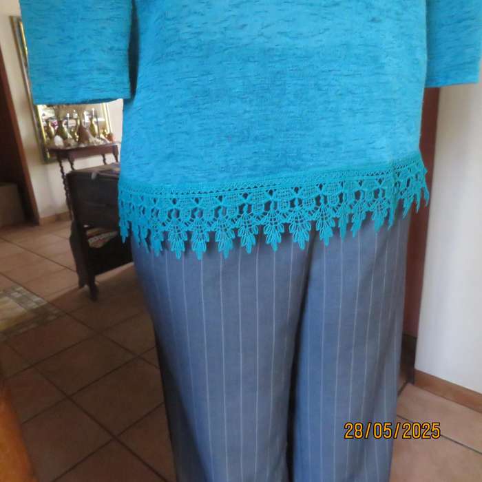 Jade green slip over textured polyester top with lace seam decoration. Size 36.