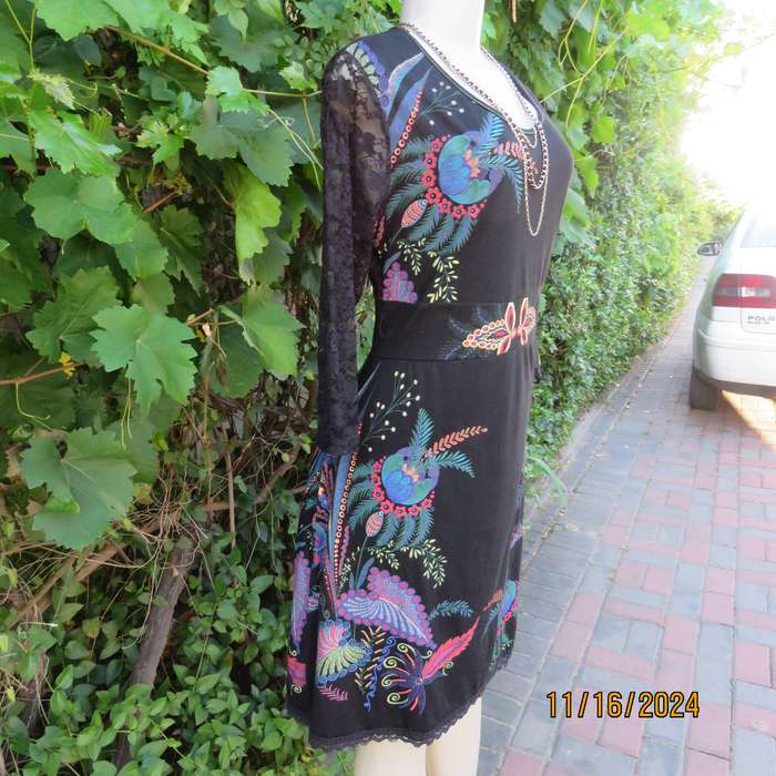 Smart casual black stretch polycotton slip over dress. Lace sleeves. Size 36-38. Jewel colour print.
