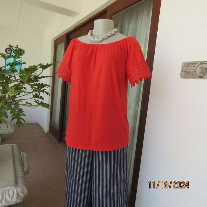 Eye catching bright red slip over polyester top. Short sleeves. Wide elasticated neckline.Size 36.