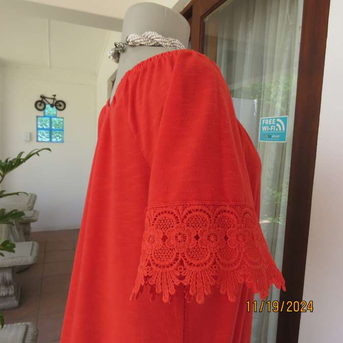 Eye catching bright red slip over polyester top. Short sleeves. Wide elasticated neckline.Size 36.