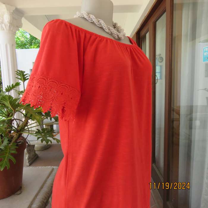 Eye catching bright red slip over polyester top. Short sleeves. Wide elasticated neckline.Size 36.