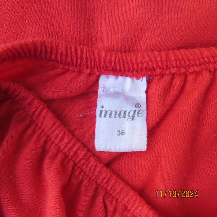 Eye catching bright red slip over polyester top. Short sleeves. Wide elasticated neckline.Size 36.