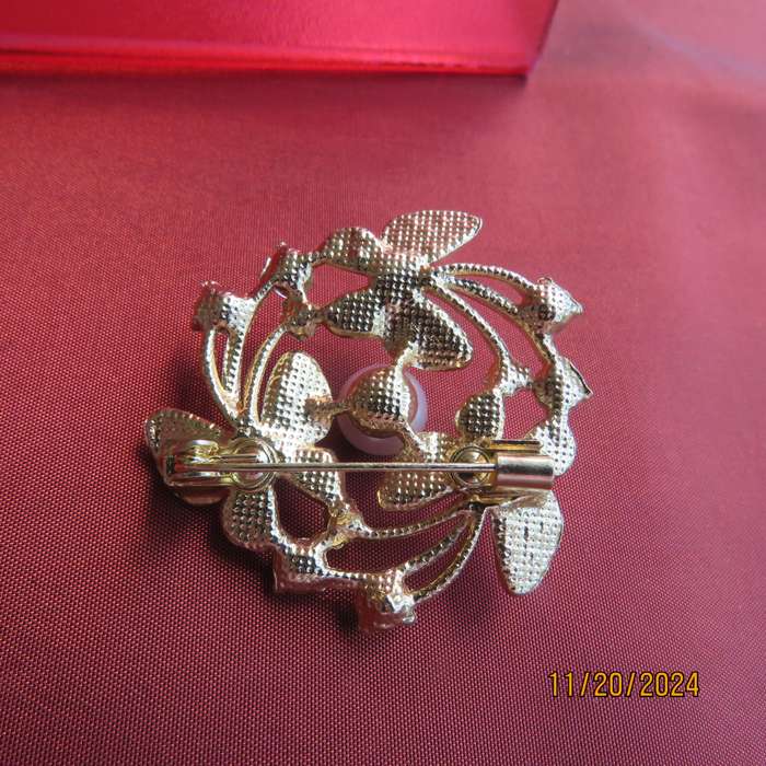 Butterfly brooch 4cm diam. in gold with lots of simulated diamonds