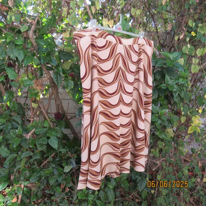 Graphic printed rich cream fully lined polyester A-Line skirt. Brown-tan print. Size 50