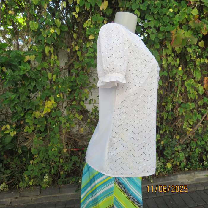 White cotton slip over top. Front and sleeves with eyelet embroidery. Size 36