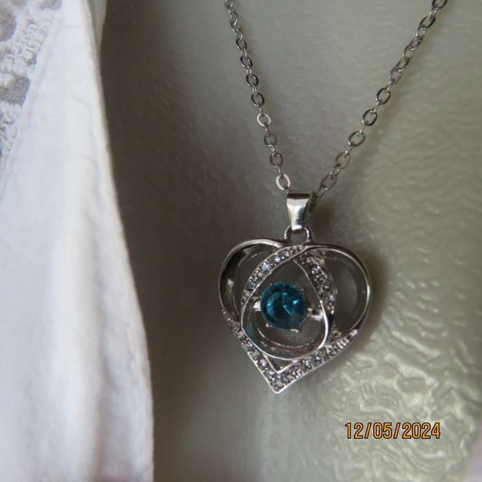 Dainty heart pendant with blue stone and faux diamonds. Silver chain. New item.
