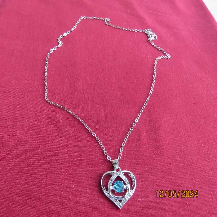 Dainty heart pendant with blue stone and faux diamonds. Silver chain. New item.