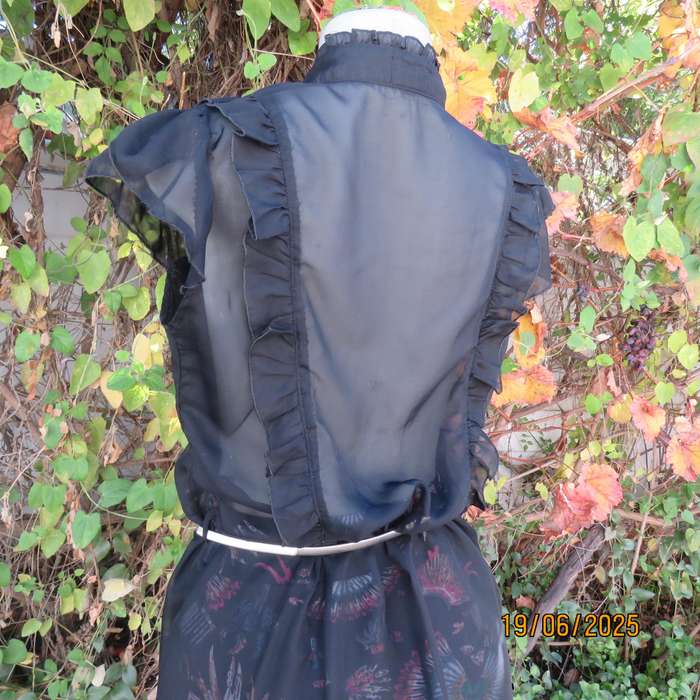 NOSTALGIA sheer black polyester peplum size 37 top. Halfway button down.