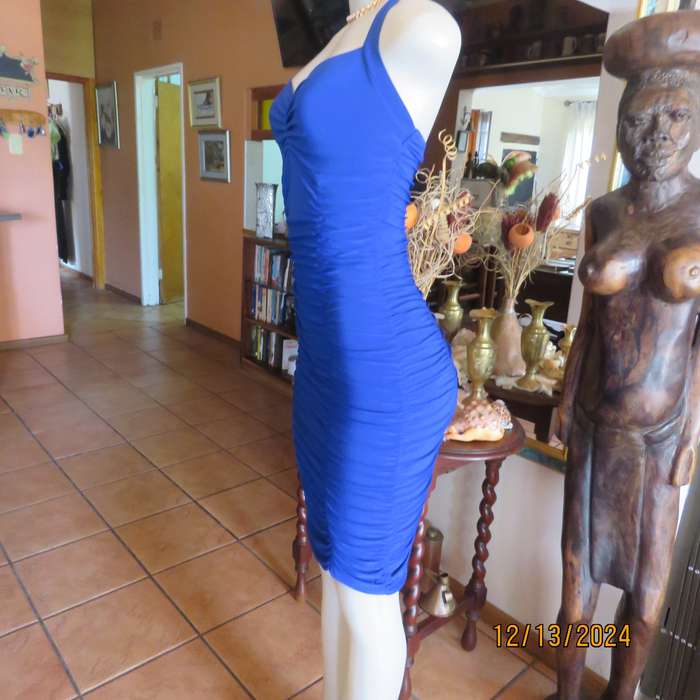 Stunning royal blue stretch polyester bodycon halter neck evening dress.Vertical elasticated.Size 34