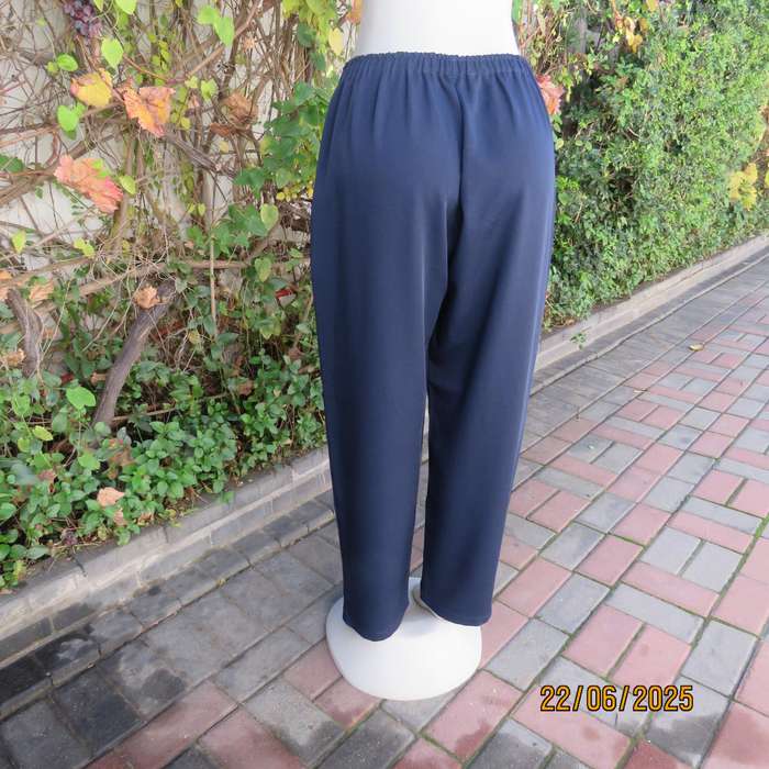 Boutique made navy comfy pant in polyester size 44. Elasticated waist.