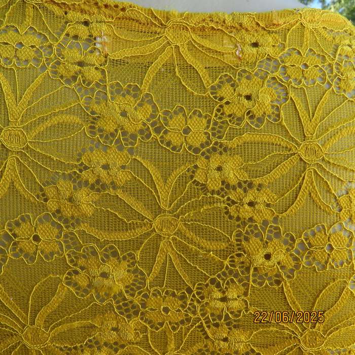 NEW FEELING mustard stretch polyester lace peplum top. Size 32. Long sleeves.