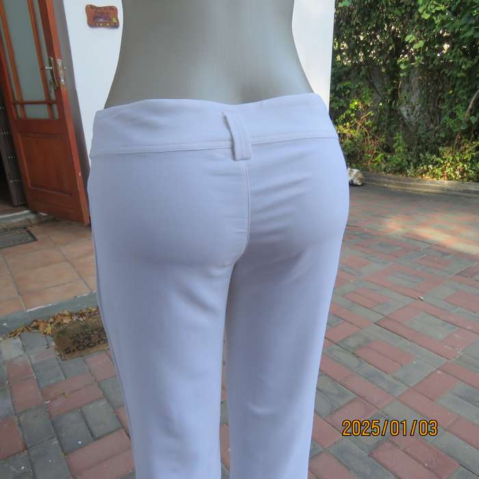 Sexy white polycotton stretch LEGIT bootlegged pants in size 34-36. No pockets. Very good condition.