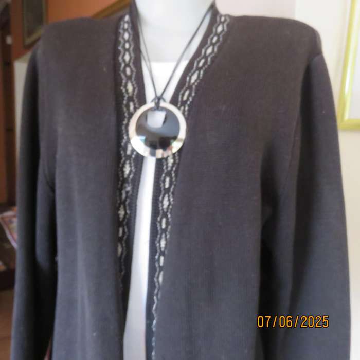 Black acrylic knit long sleeve knitted button down cardigan. Silver thread fronts-pockets. Size 44