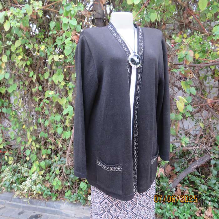 Black acrylic knit long sleeve knitted button down cardigan. Silver thread fronts-pockets. Size 44