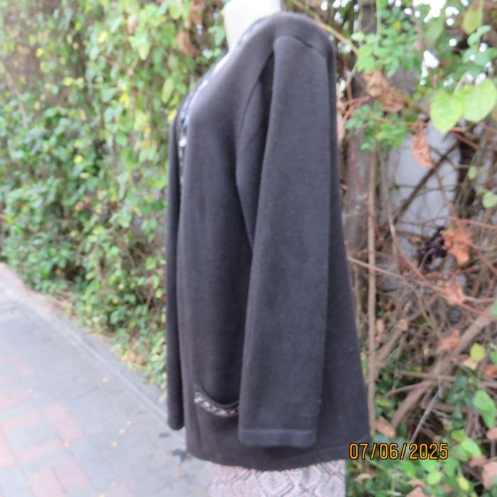Black acrylic knit long sleeve knitted button down cardigan. Silver thread fronts-pockets. Size 44