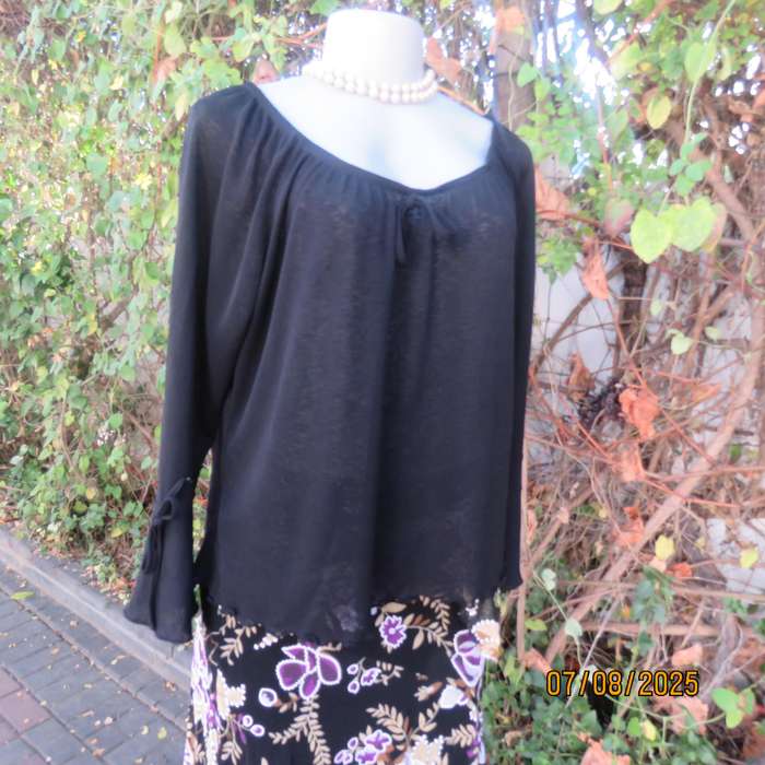 Black opaque polyester off the shoulder top with elasticated neckline. Size 42