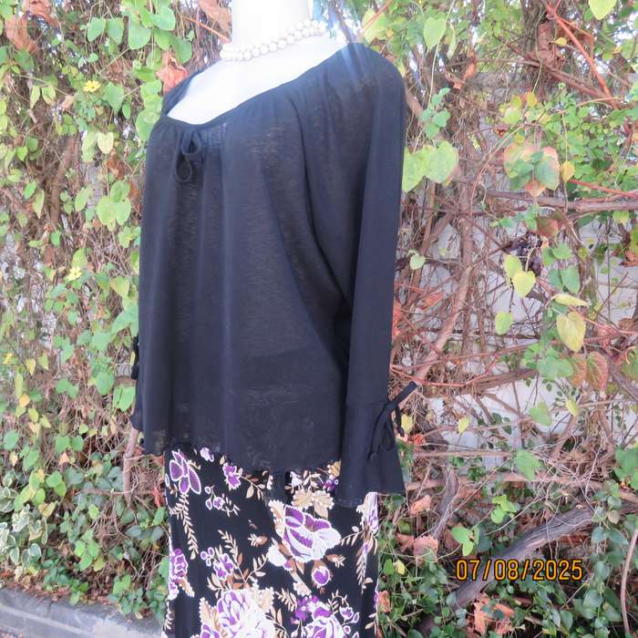 Black opaque polyester off the shoulder top with elasticated neckline. Size 42