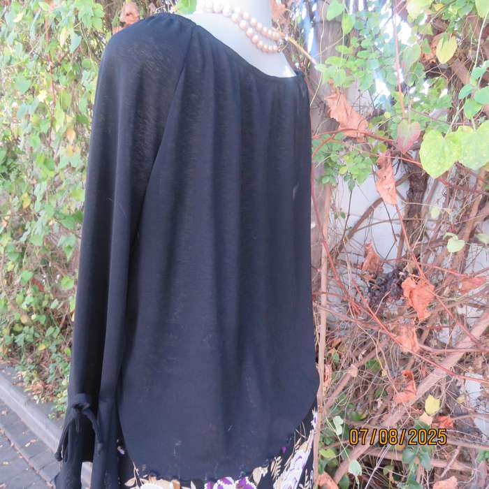 Black opaque polyester off the shoulder top with elasticated neckline. Size 42