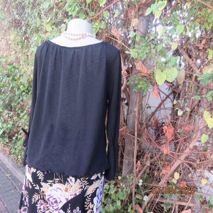 Black opaque polyester off the shoulder top with elasticated neckline. Size 42