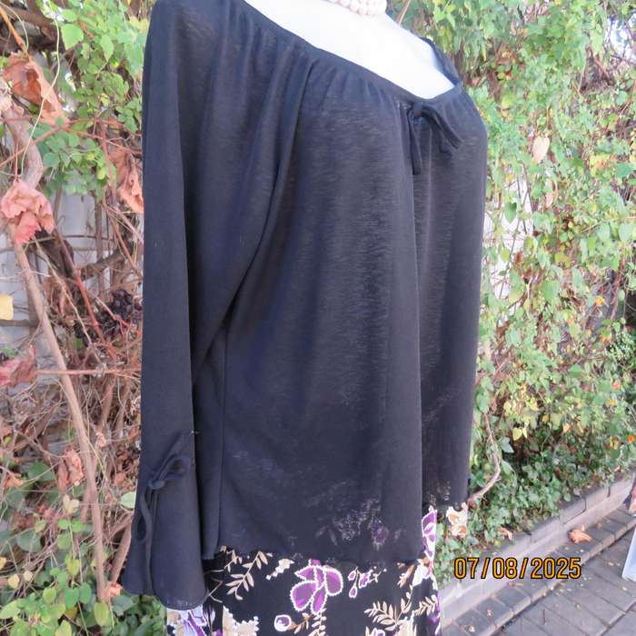 Black opaque polyester off the shoulder top with elasticated neckline. Size 42