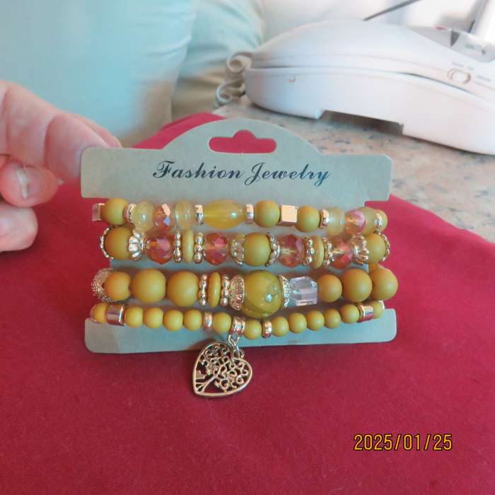 Luxury beaded set of 4 stretch autumn colour bangles with some gold. New item.