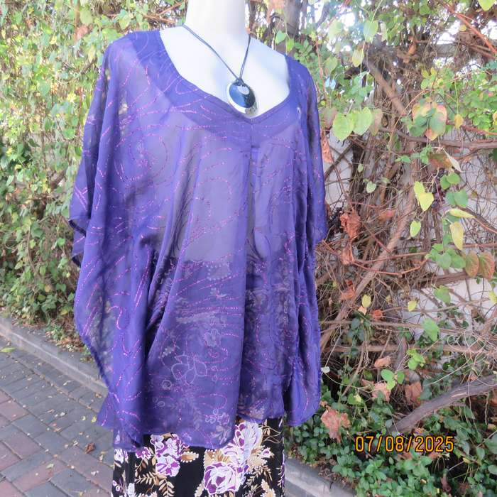 Boutique made sheer purple halfmoon top with glimmer twirls. Pleat on front. Size 40-44