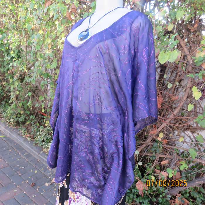 Boutique made sheer purple halfmoon top with glimmer twirls. Pleat on front. Size 40-44