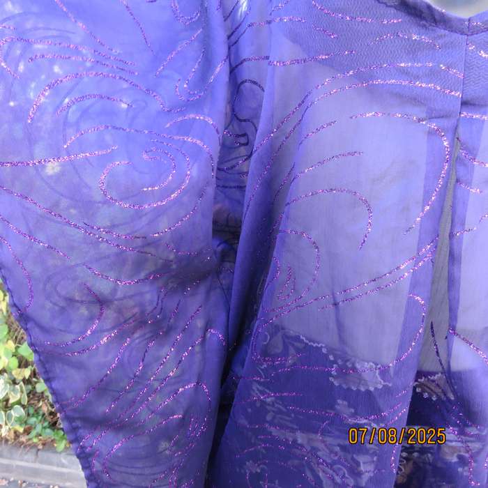 Boutique made sheer purple halfmoon top with glimmer twirls. Pleat on front. Size 40-44