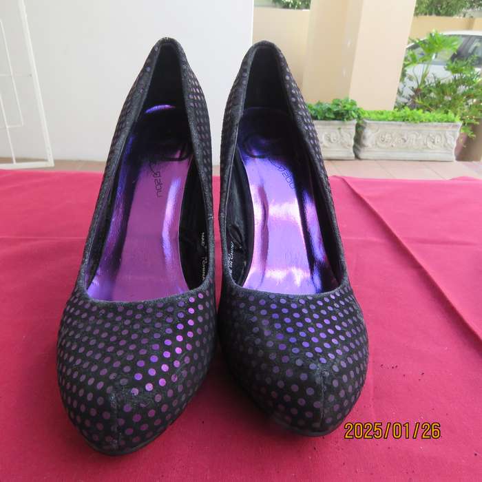 Pair black velvety pumps with shiny purple polkadots. Size 4 by Free 2byou. Good condition
