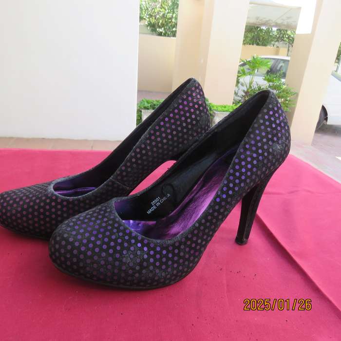Pair black velvety pumps with shiny purple polkadots. Size 4 by Free 2byou. Good condition