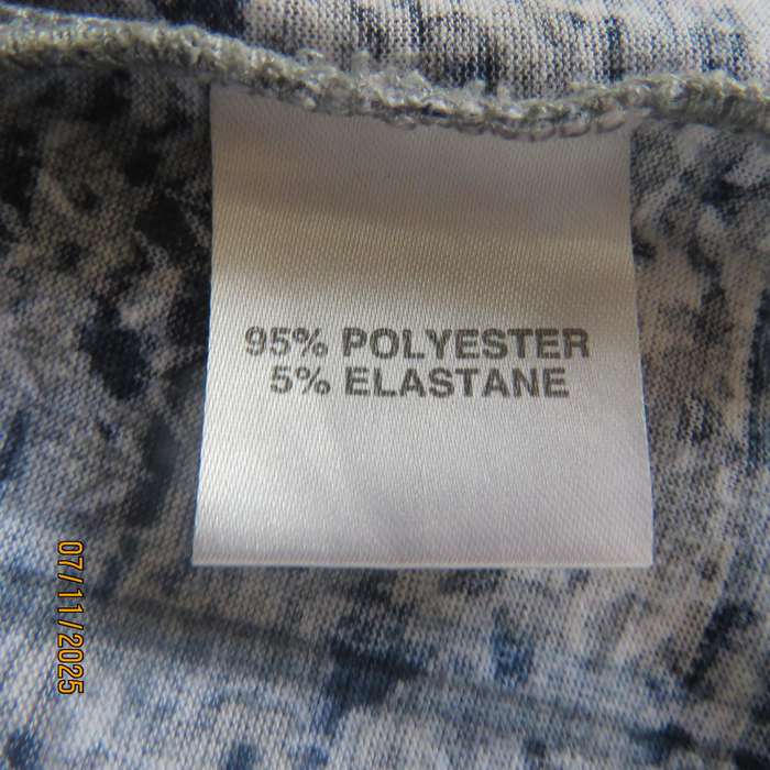 Slip over polyester stretch pattern blocked top in shades of blue-white-grey. High neck. Size 36
