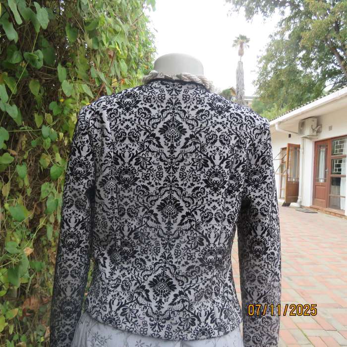 Silver grey stretch polyester long sleeve open elegant jacket.Black velvet baroque embossed. Size 32