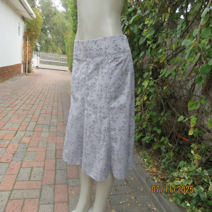 EXACT silver grey A Line paneled skirt with darker grey tiny flowers. Size 38.