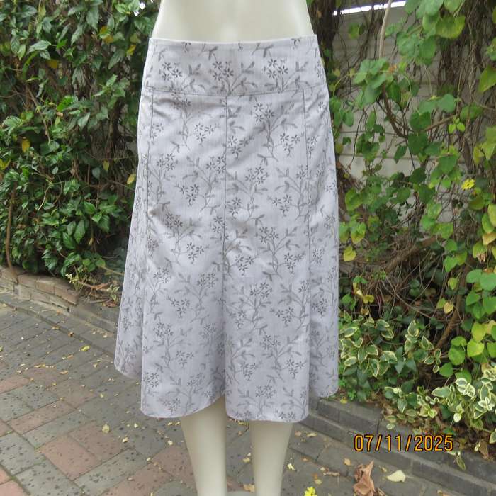 EXACT silver grey A Line paneled skirt with darker grey tiny flowers. Size 38.